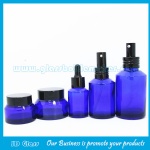 15ml-100ml Blue Sloping Shoulder Glass Lotion Bottles and 15g-50g Blue Glass Cosmetic Jars with Caps